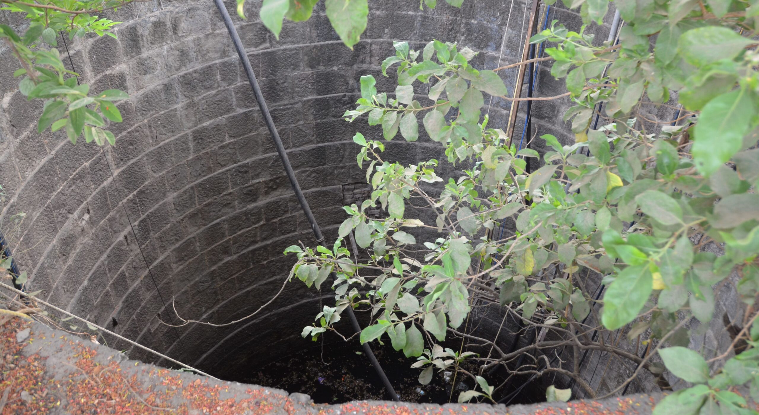 A well located in rural Maharashtra with notably depleted water levels